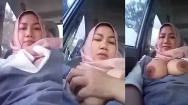 Bokep Jilbab Tante Pamer Toket Gede di Mobil Basah